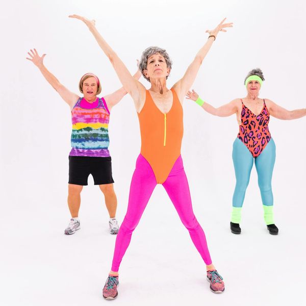 Woman stretching gracefully outdoors, feeling energized and flexible.